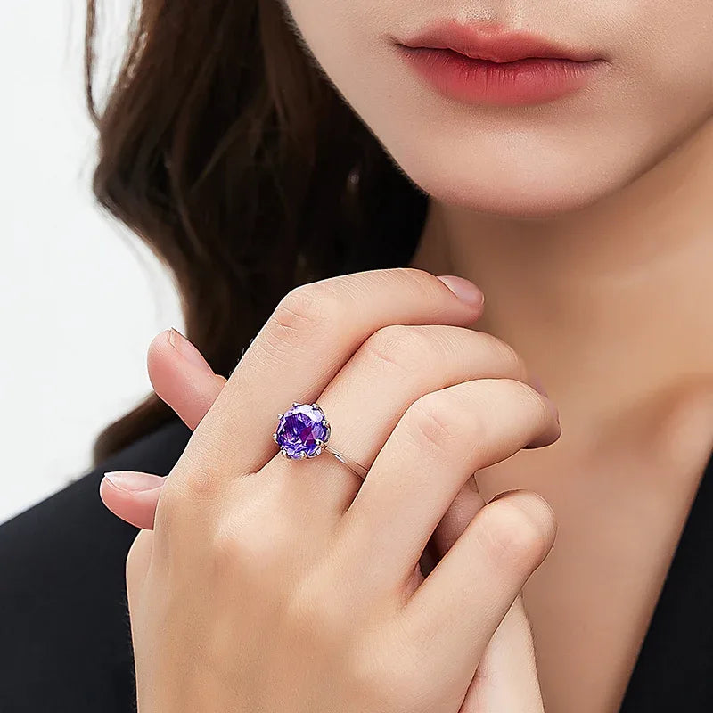 round amethyst solitaire ring worn on the hand from a second angle