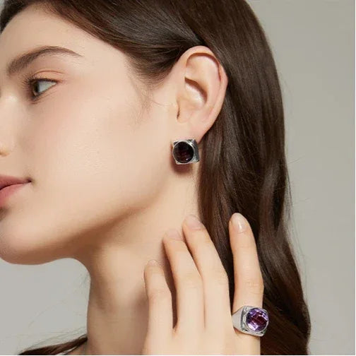 round amethyst stud earrings paired product view on a white background