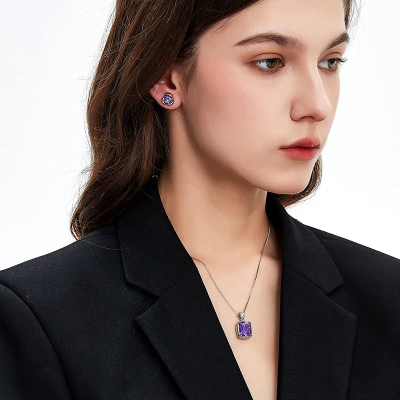 round amethyst stud earrings worn on the ear from a second angle