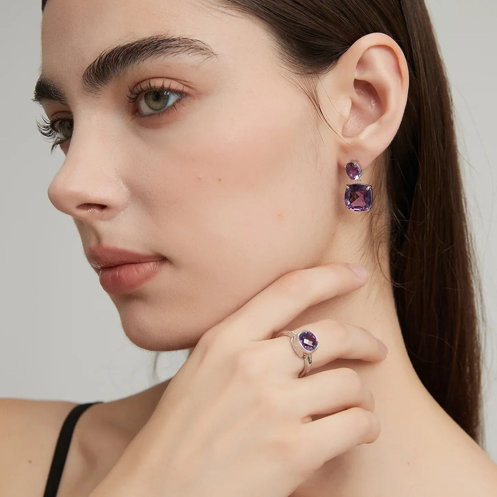 round amethyst halo ring styled portrait showing the ring for scale
