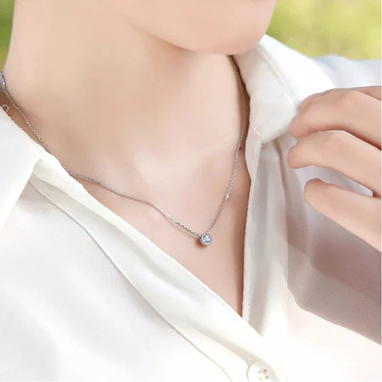 Round Aquamarine Bezel Pendant Necklace styled neckline view showing pendant scale