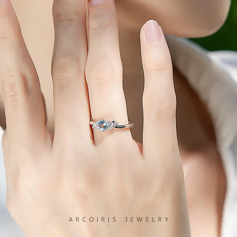 Round Aquamarine Floral Accent Ring worn on the hand from a second angle