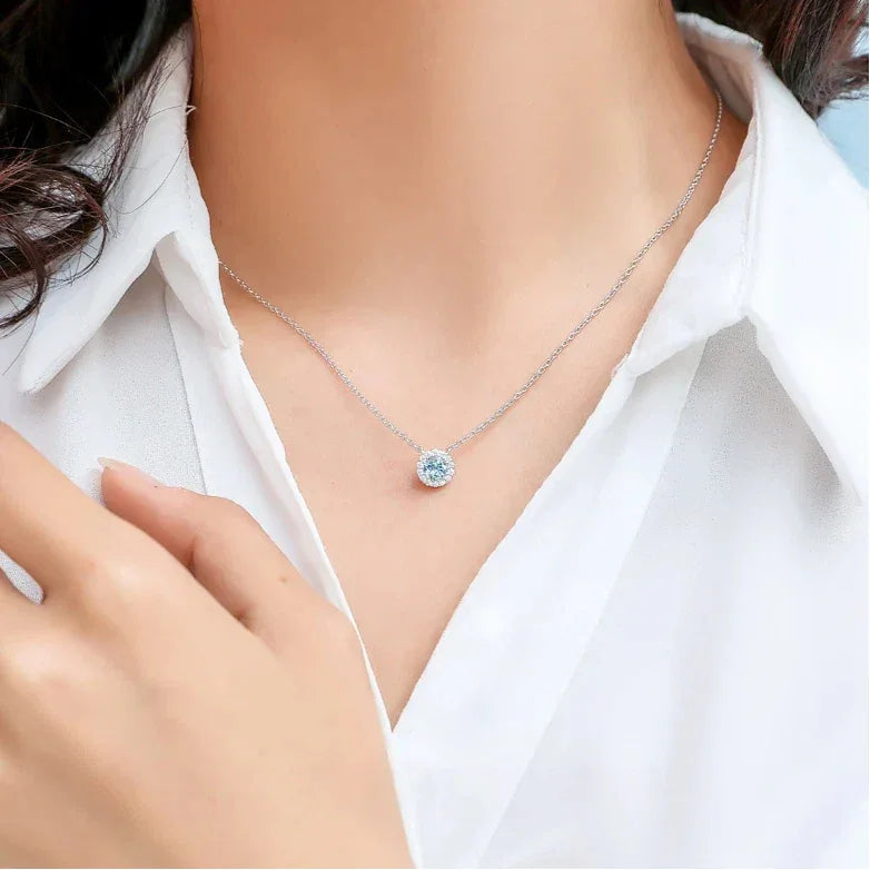 Round Aquamarine Halo Pendant Necklace worn at the neckline from a second angle