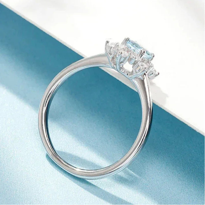 Round Aquamarine Snowflake Halo Ring angled product view showing the setting