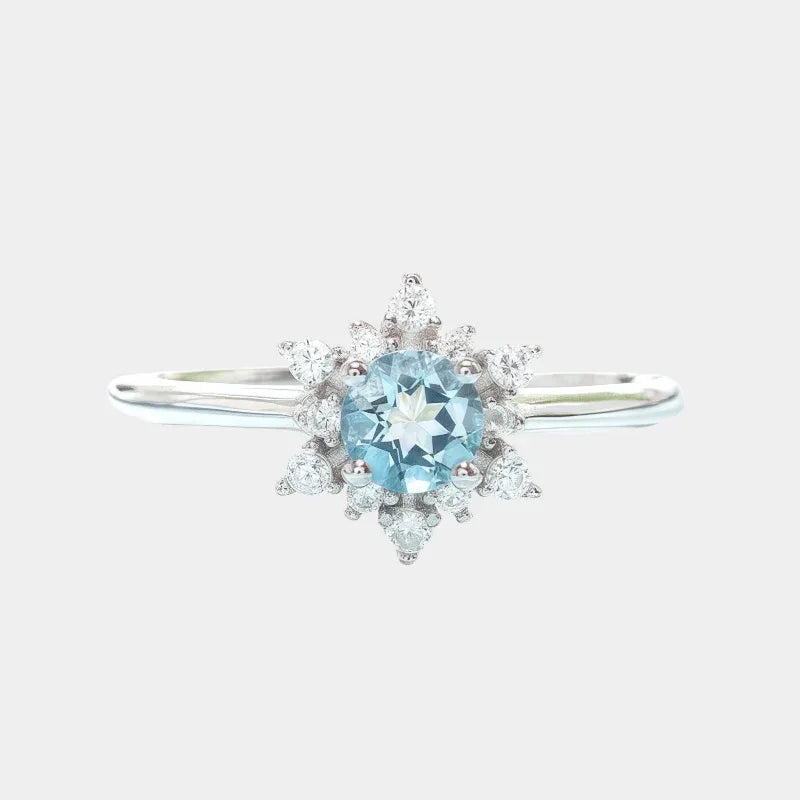 Round Aquamarine Snowflake Halo Ring front product view on a white background