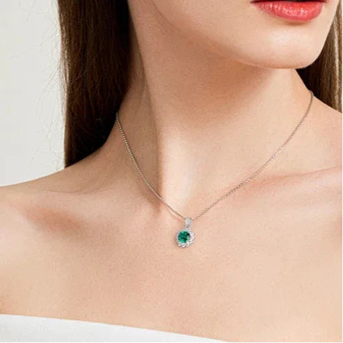 Round Emerald Sunflower Pendant Necklace worn at the neckline from a second angle