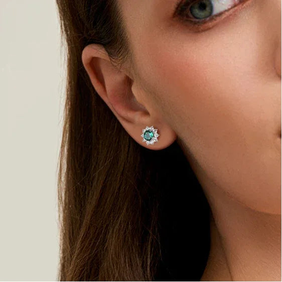 Round Emerald Sunflower Stud Earrings styled ear view showing scale