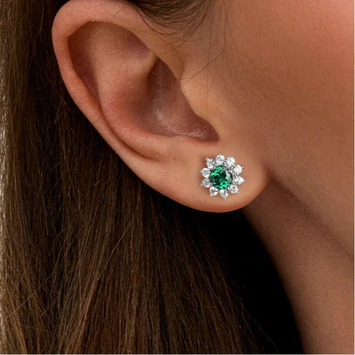 Round Emerald Sunflower Stud Earrings worn on the ear from a second angle