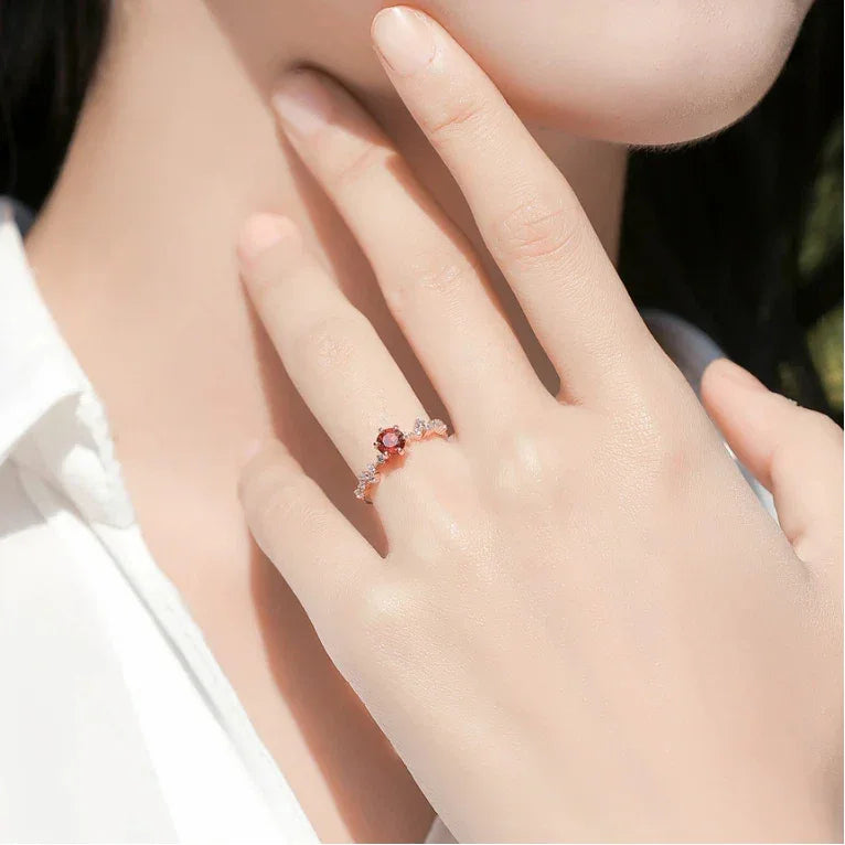 Round Garnet Crown Band Ring worn on the hand from a second angle