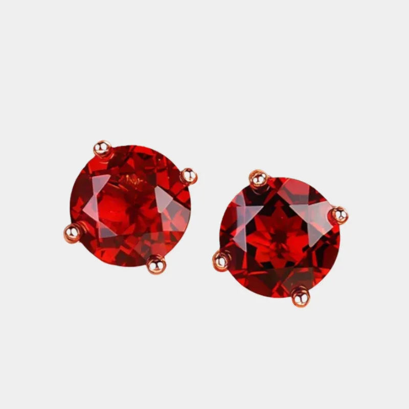 Round Garnet Four-Prong Stud Earrings front product view on a light background