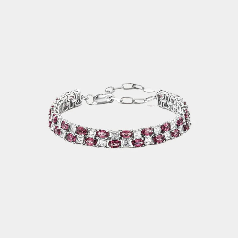 Round Garnet Tennis Bracelet full bracelet view on a light background