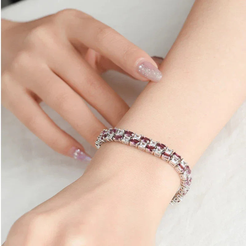 Round Garnet Tennis Bracelet worn on the wrist from a second angle