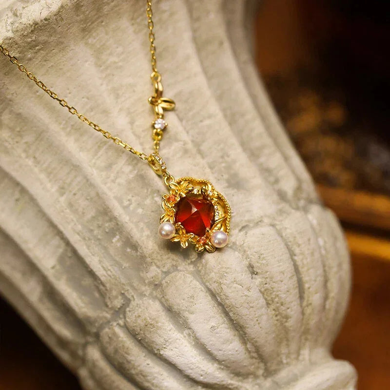 Round Garnet Vintage Drop Necklace worn at the neckline from a second angle