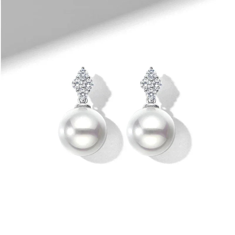 Pearl Teardrop Stud Earrings — front pair on white showing design and scale