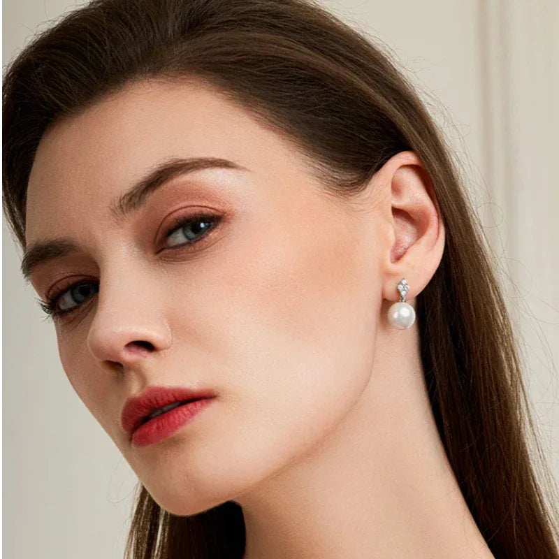 Pearl Teardrop Stud Earrings — alternate model portrait showing scale