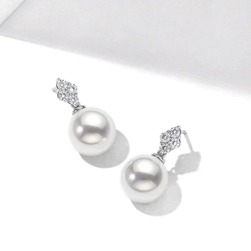 Pearl Teardrop Stud Earrings — angled pair on white showing the post backs