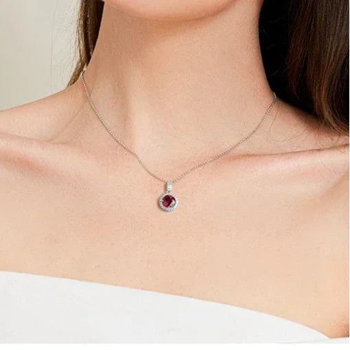 Round Ruby Halo Pendant Necklace — necklace worn at neckline