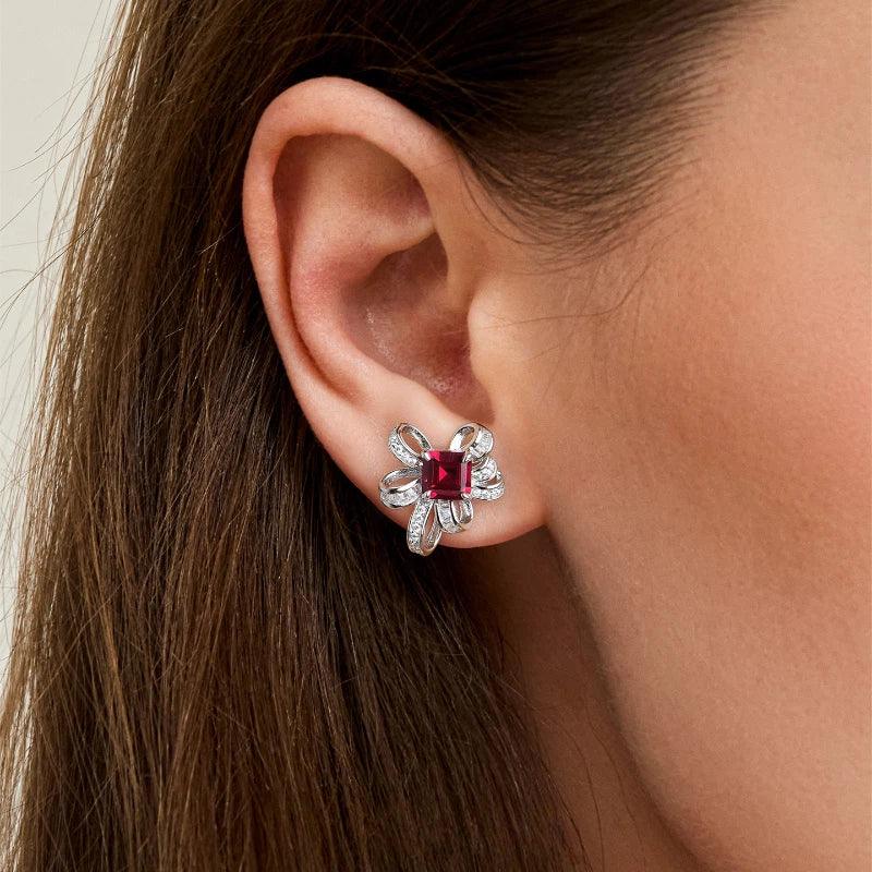 Ruby Bowknot Four-Claw Set Earrings — earrings worn on ear
