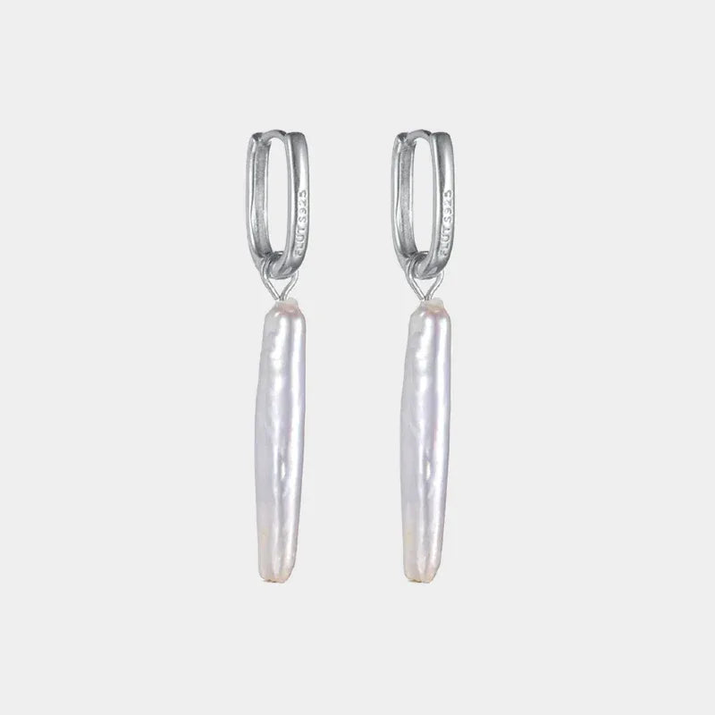 Long Baroque Pearl Drop Earrings — isolated front pair with long slim pearl drops