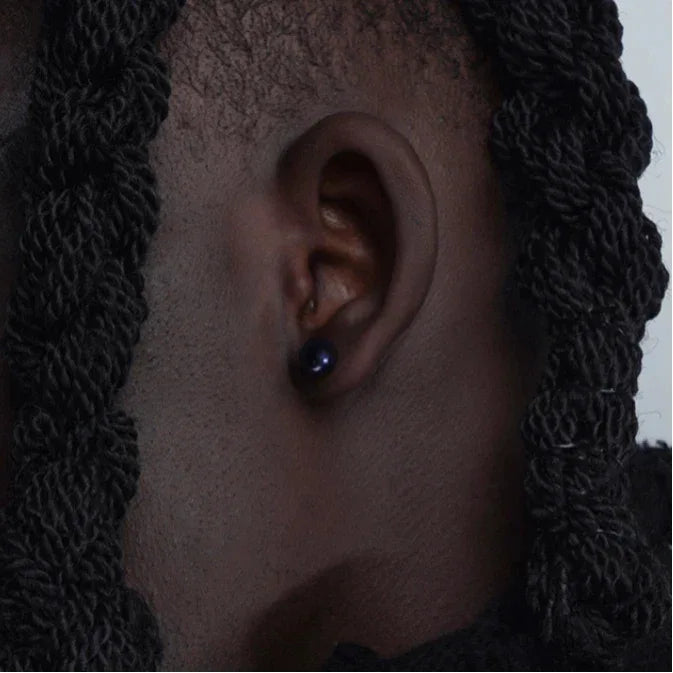 Dark Pearl Stud Earrings — alternate right-ear worn view showing design and scale