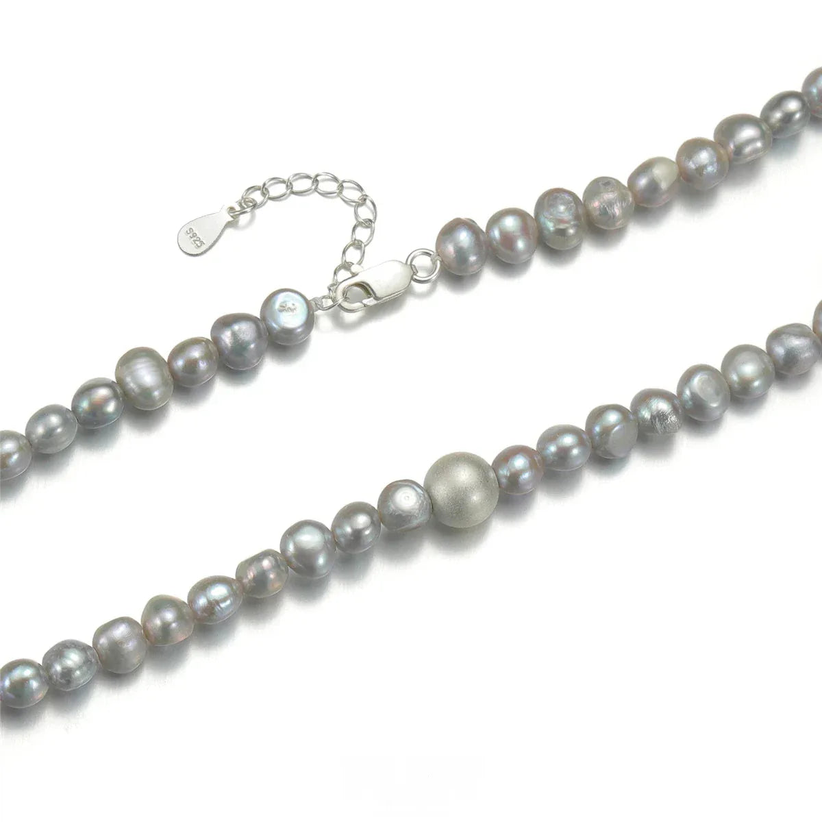 Gray Pearl Strand Necklace with Adjustable S925 — macro comparison view showing the gray pearls and one larger pale pearl