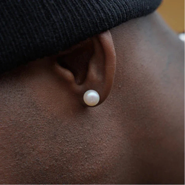 Round Pearl Stud Earrings — right-ear worn close-up showing scale