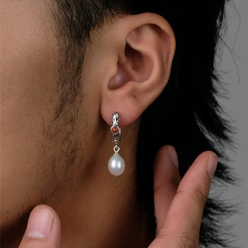 S925 Silver Pearl Drop Huggie Earrings with Red Accent — left-ear worn close-up showing the red accent and pearl scale