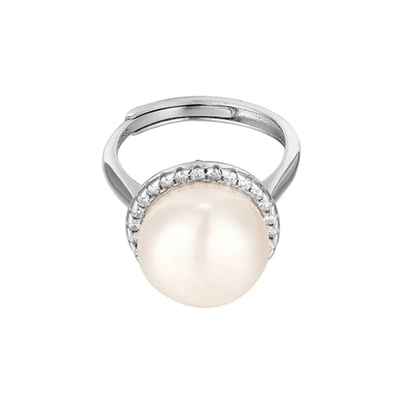 Adjustable Pearl Halo Ring — side view showing the raised pearl setting and open adjustable band