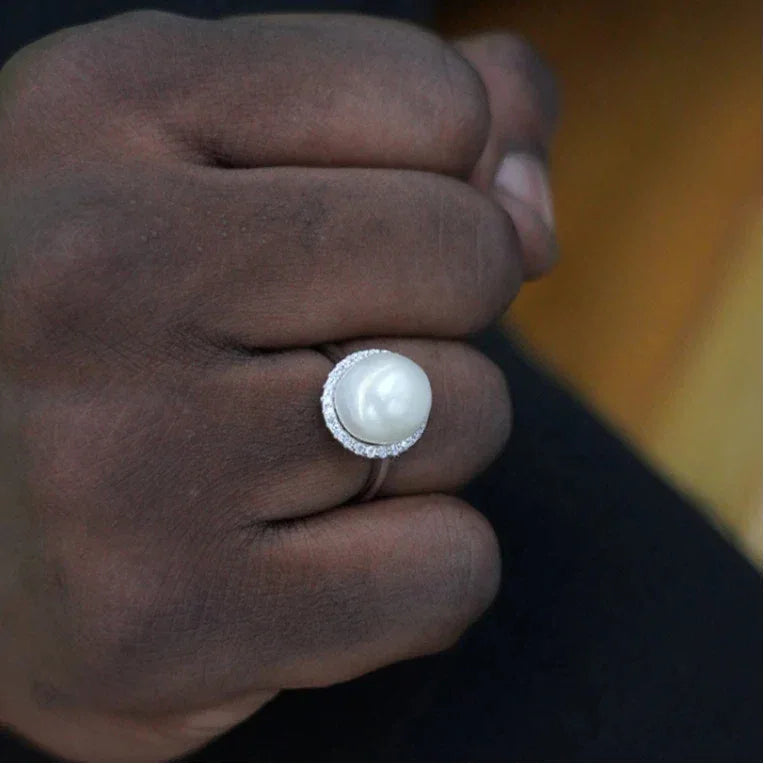 Adjustable Pearl Halo Ring — close hand-worn view showing the pearl scale