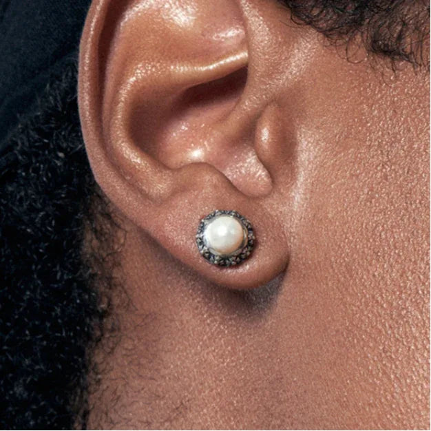Antiqued Floral Halo Pearl Stud Earrings — close right-ear worn view showing scale