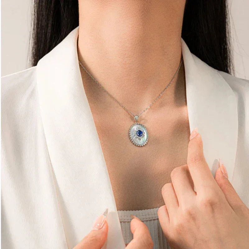 Sapphire and Mother-of-Pearl Oval Pendant Necklace — close neckline-worn view showing scale