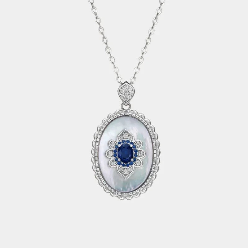 Sapphire and Mother-of-Pearl Oval Pendant Necklace — front view of oval sapphire and mother-of-pearl pendant necklace