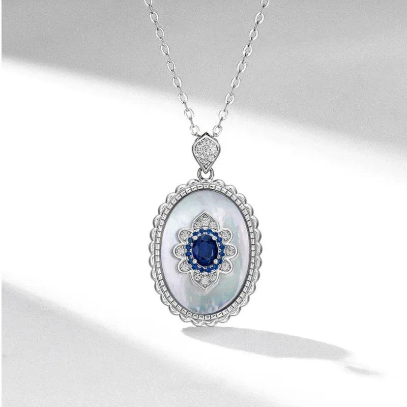 Sapphire and Mother-of-Pearl Oval Pendant Necklace — front pendant view on white