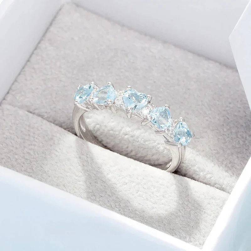 Seven-Stone Aquamarine Band Ring angled product view showing the setting