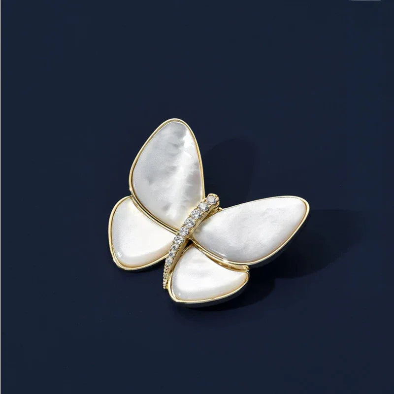 White Pearl Butterfly Brooch — front product view on a dark background