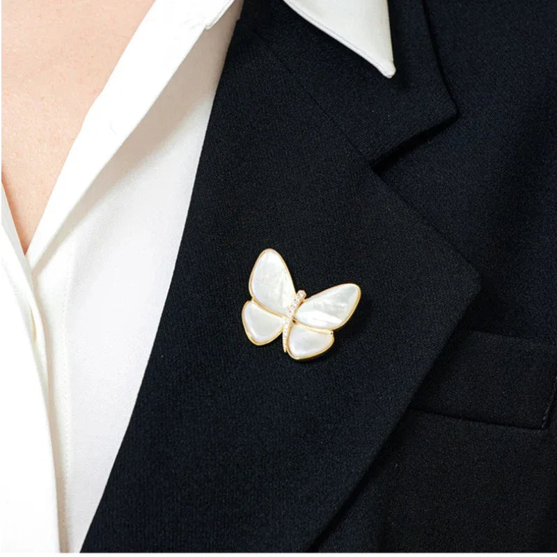 White Pearl Butterfly Brooch — close blazer-worn view showing lapel scale