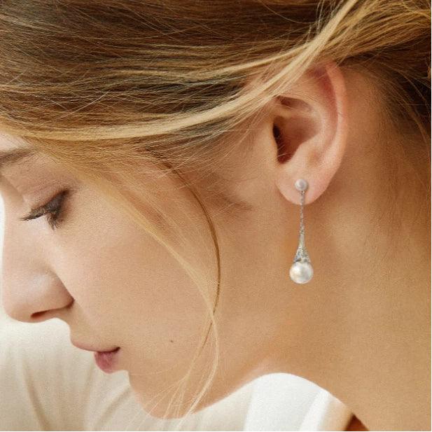 Shell Pearl Eiffel Tower Drop Earrings — silver-tone earrings worn in a downward-facing profile