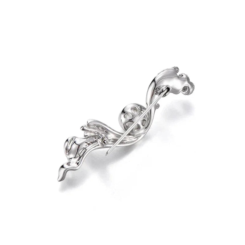 Pearl Flowing Ribbon Brooch — angled product view showing the layered ribbon curves