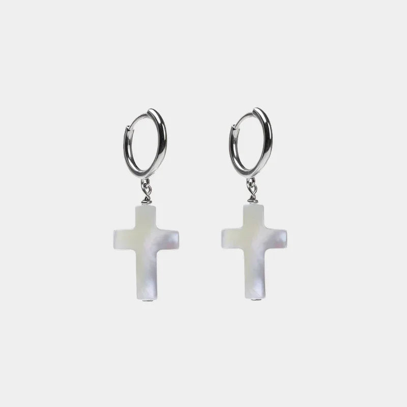 Pearl Cross Drop Hoop Earrings — front pair of silver-tone hoops with iridescent white cross drops