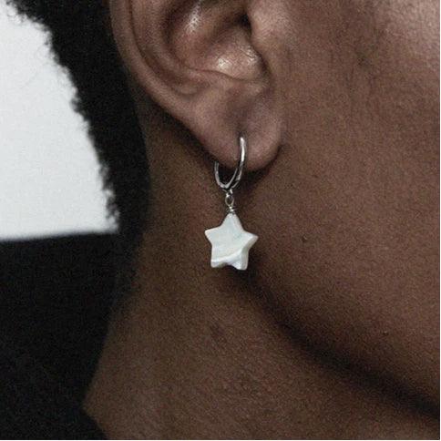 Pearl Star Drop Hoop Earrings — left-ear worn close-up showing the star-drop scale