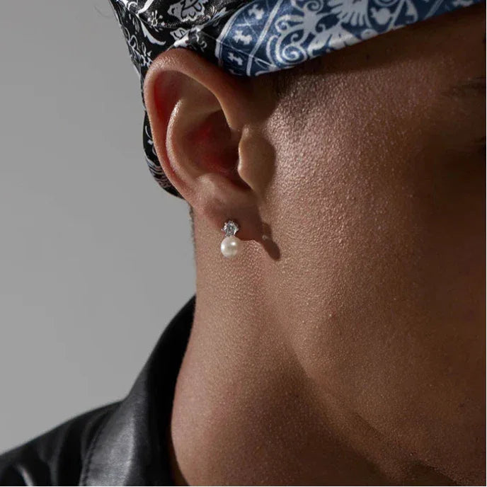 Pearl Drop Stud Earrings with Geometric Top — right-ear worn close-up beneath a patterned headscarf
