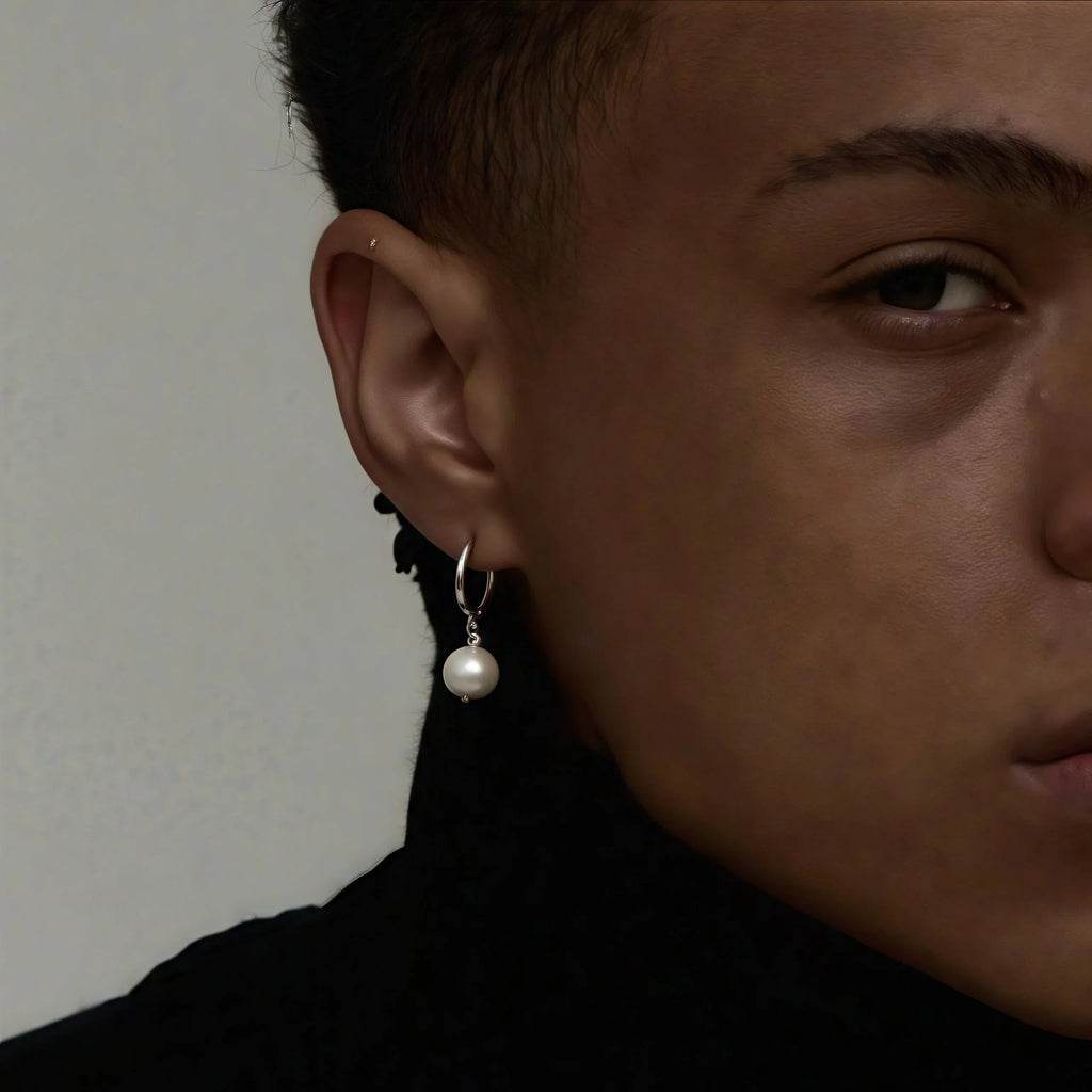 Double-Pearl Drop Hoop Earrings — right-ear worn portrait showing the two pearl drops