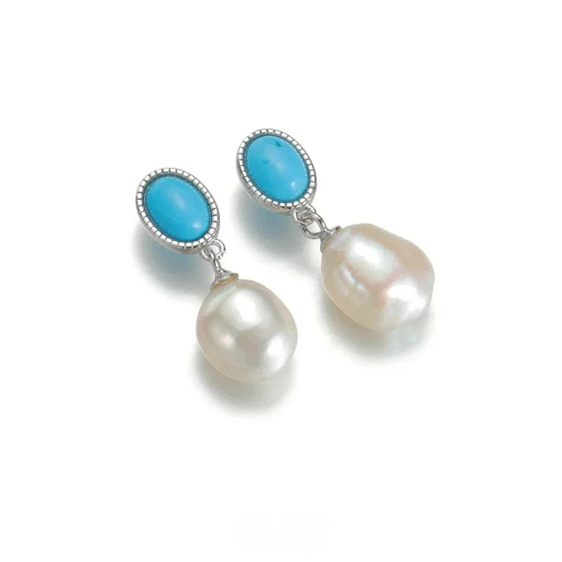 Pearl Drop Earrings with Turquoise-Blue Oval Accents in S925 Silver - pair arranged diagonally on white