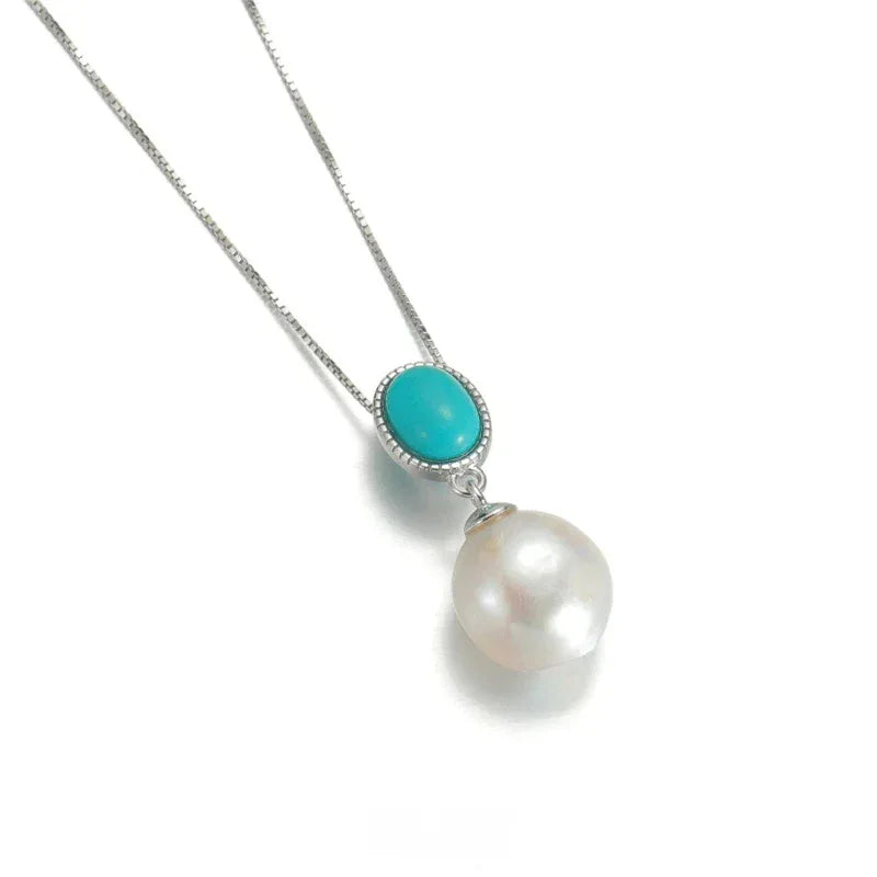 Pearl Drop Pendant Necklace with Turquoise-Blue Oval Accent in S925 Silver - angled pendant and chain on white