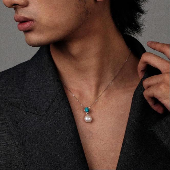 Pearl Drop Pendant Necklace with Turquoise-Blue Oval Accent in S925 Silver - portrait worn view with a dark jacket