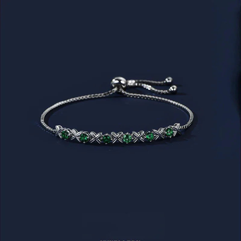 Six-Flower Emerald Adjustable Bracelet bracelet view on a dark background