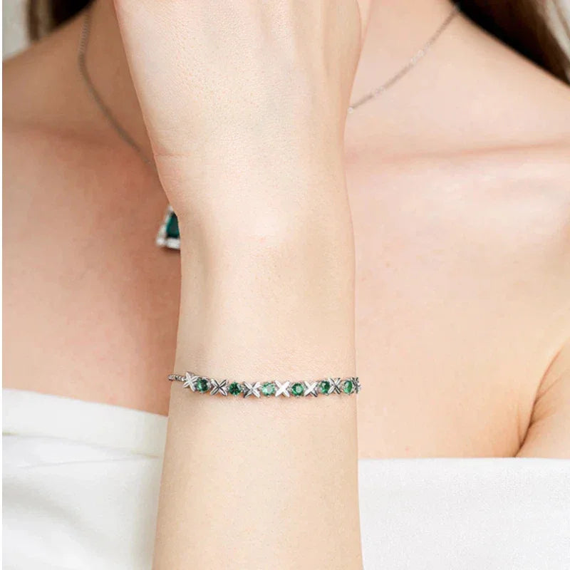 Six-Flower Emerald Adjustable Bracelet worn on the wrist from a second angle