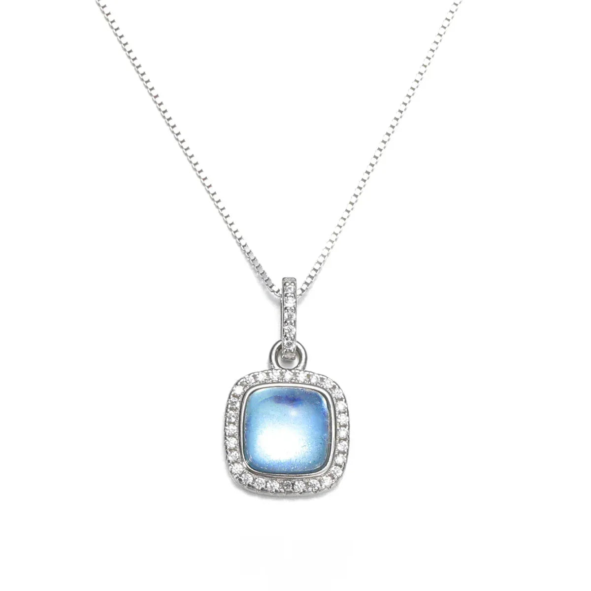 Square Aquamarine Halo Pendant Necklace pendant and chain detail on a light background
