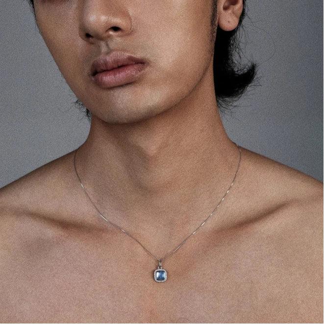 Square Aquamarine Halo Pendant Necklace worn at the neckline from a second angle