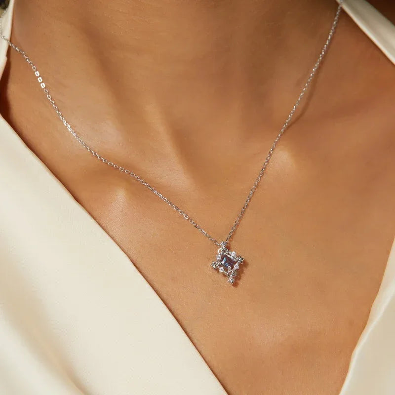 Square-cut Alexandrite filigree pendant necklace, shown worn in a close lifestyle view